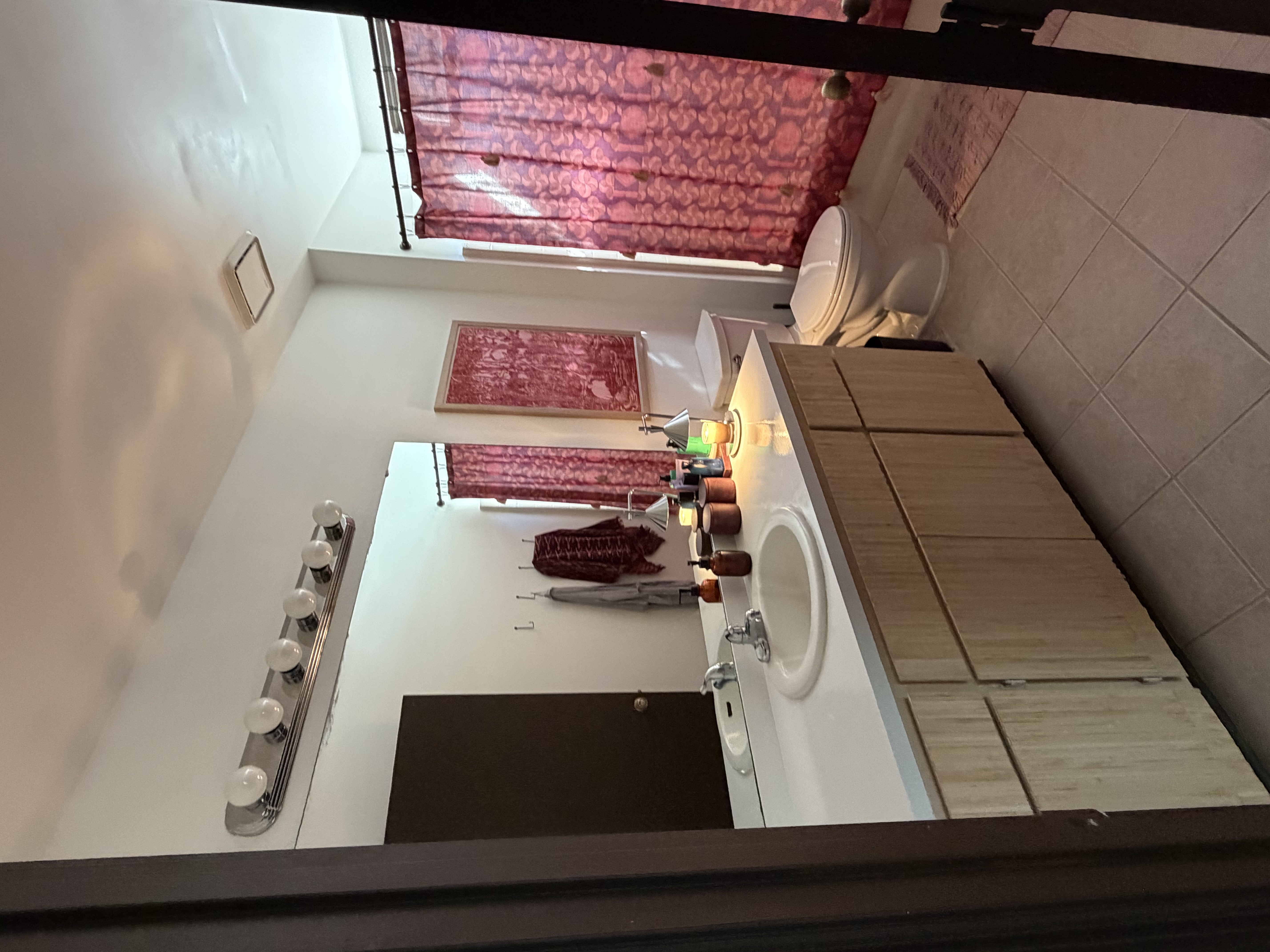 Beautifully decorated and clean bathroom with modern fixtures and bright lighting