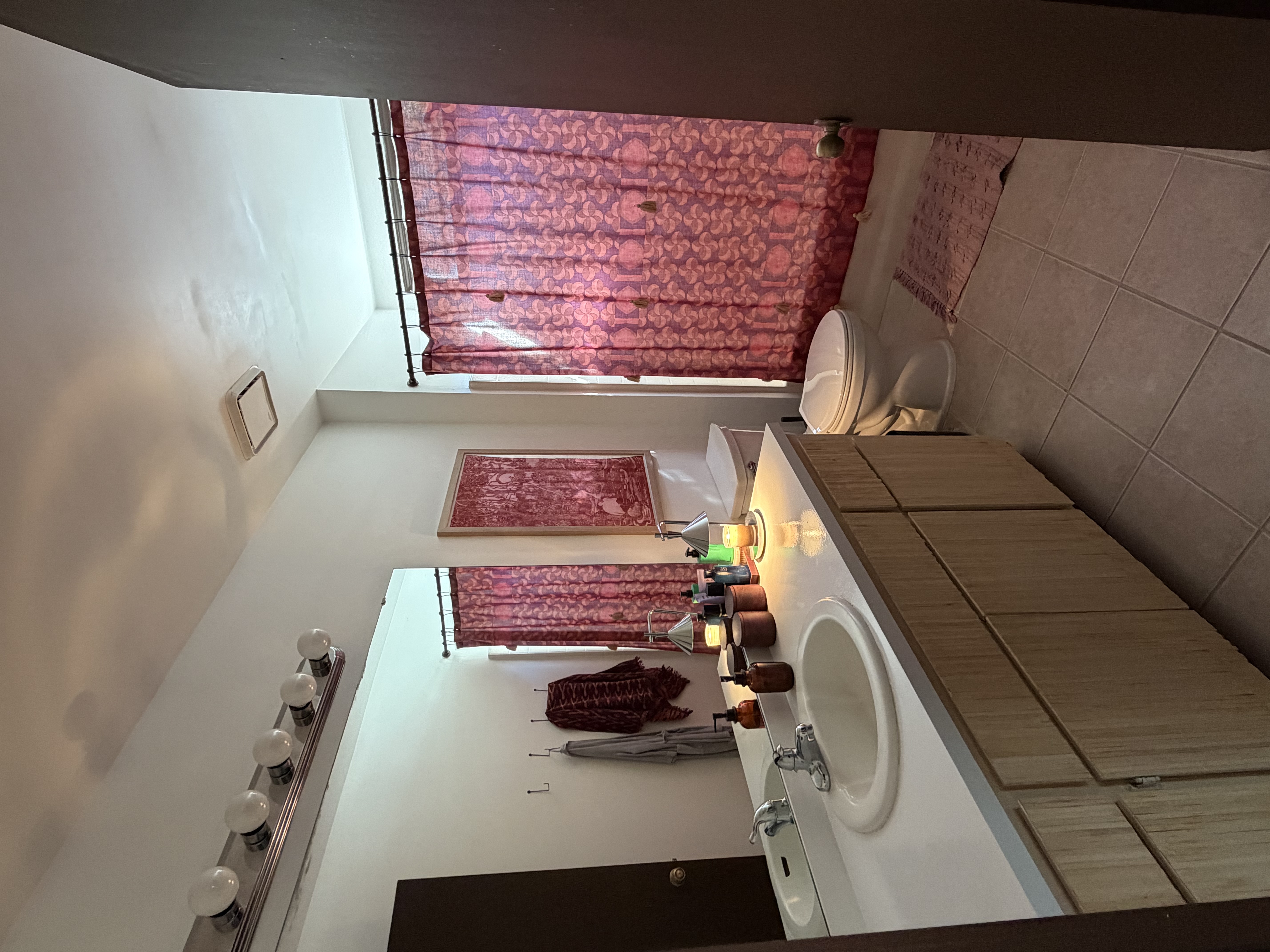 Beautifully decorated and clean bathroom with modern fixtures and bright lighting