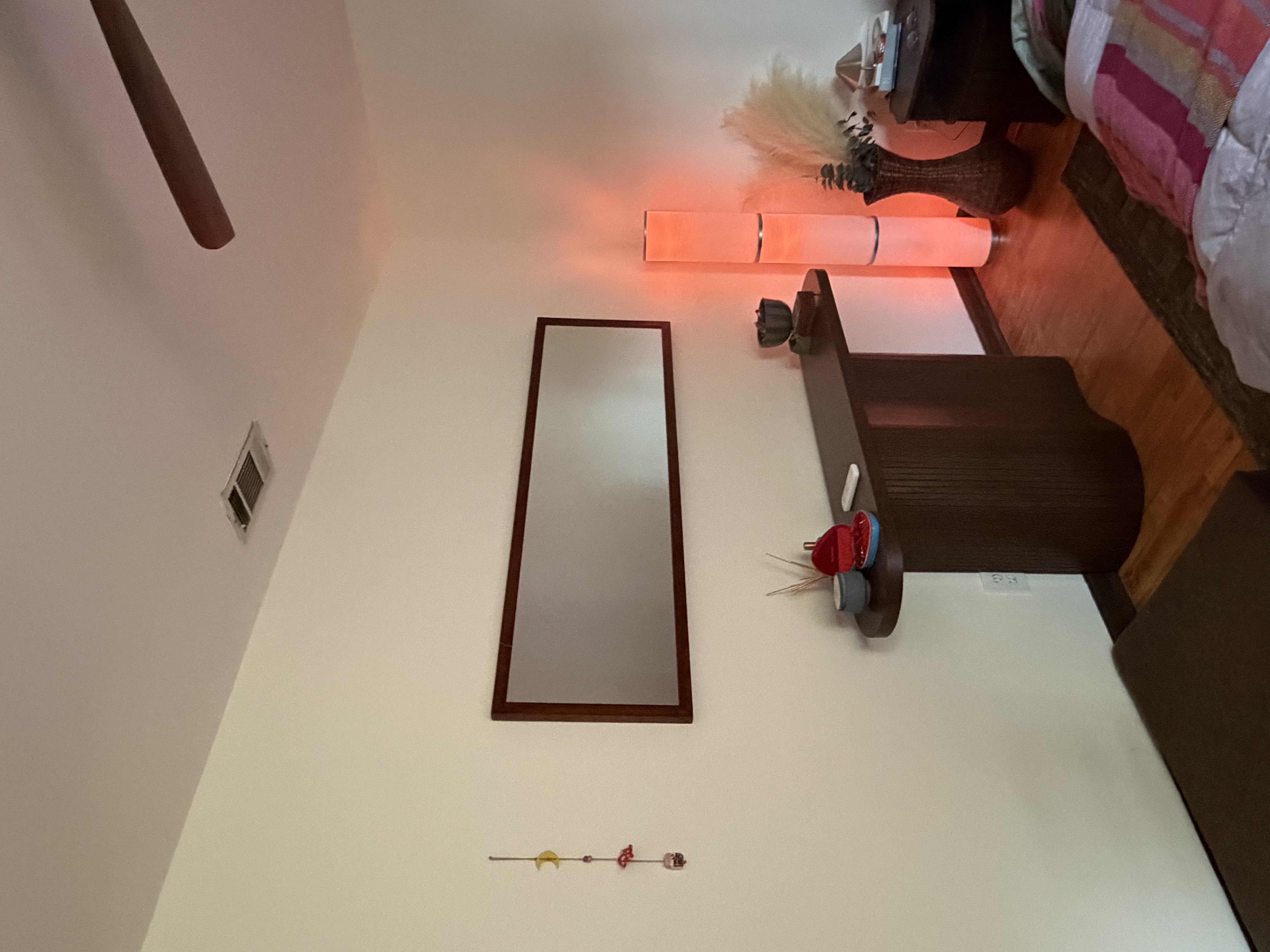 Main bedroom with layered textures, wool rugs, and soft natural light throughout