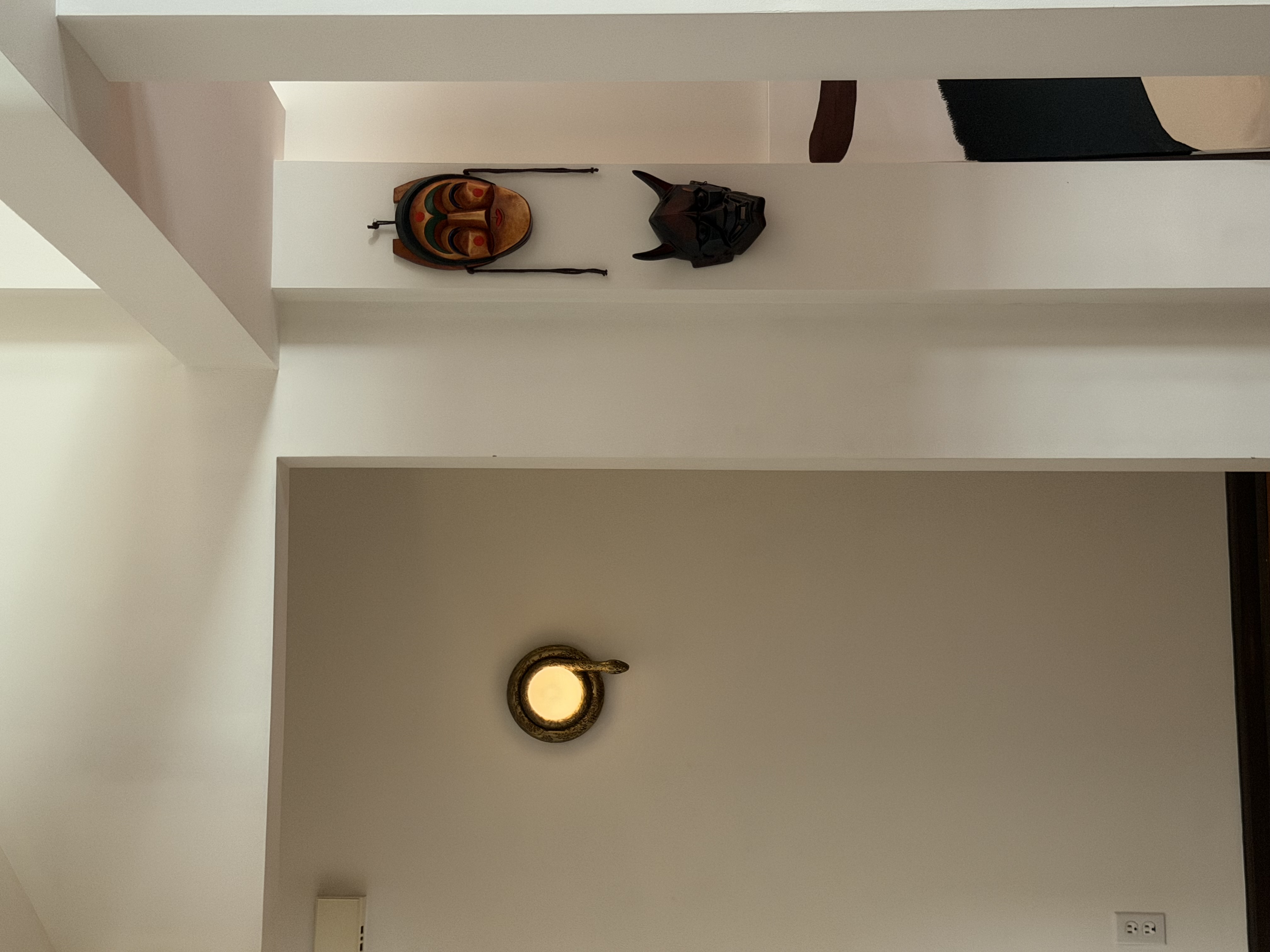 Living space featuring curated artwork from around the world and warm design elements